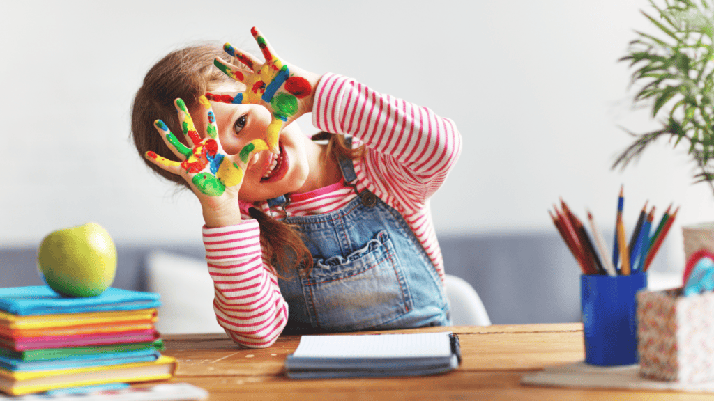 A Child at Daycare with Paint on Their Hands